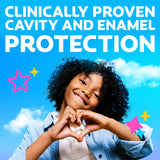 Child making a heart shape with hands against a blue sky background with stars. In text: Clinically proven cavity and enamel enamel protection.