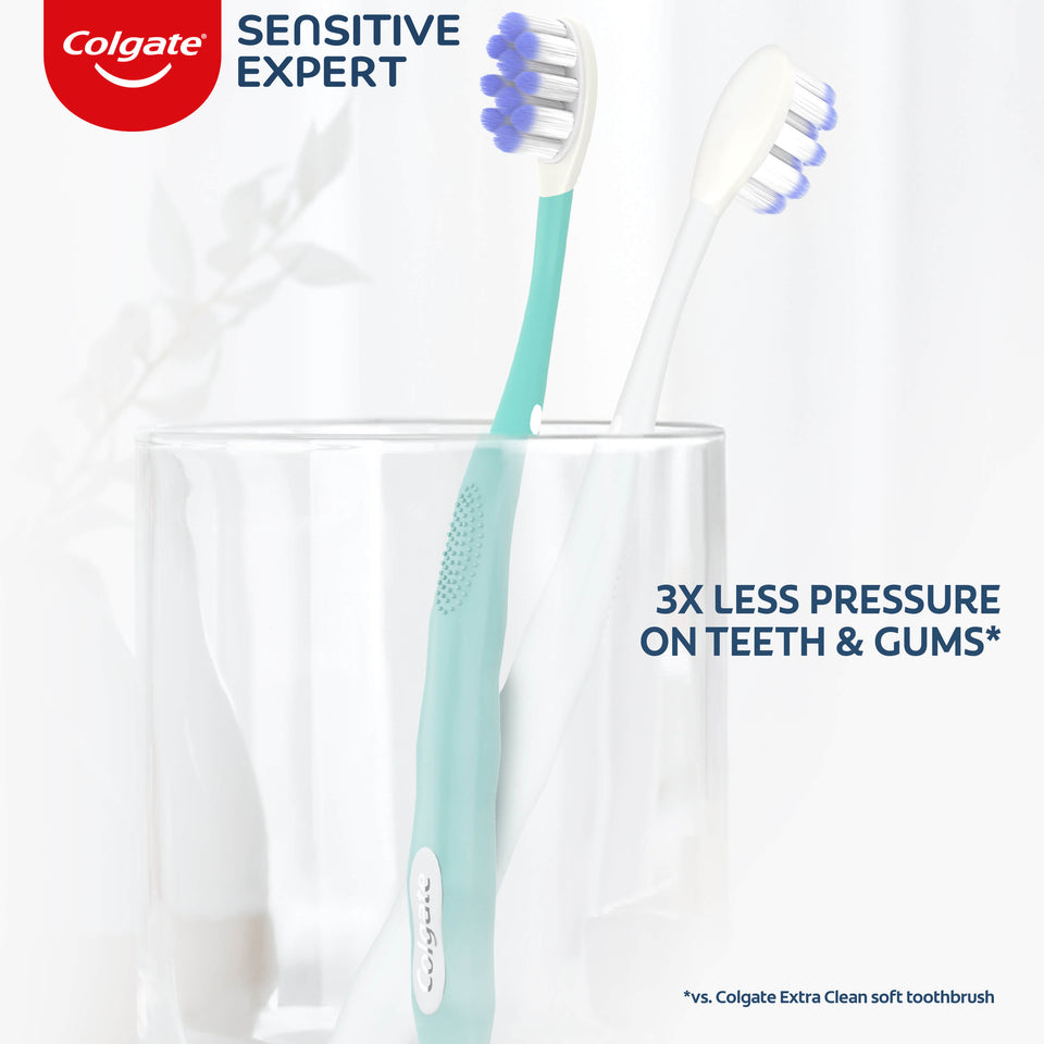 Two Colgate Sensitive Expert Ultra Soft Toothbrushes in a toothbrush holder. In text: 3x less pressure on teeth & gums* *vs. Colgate Extra Clean soft toothbrush.