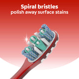 Colgate 360° Advanced Optic White Manual Toothbrush. In text: Spiral bristles polish away surface stains.