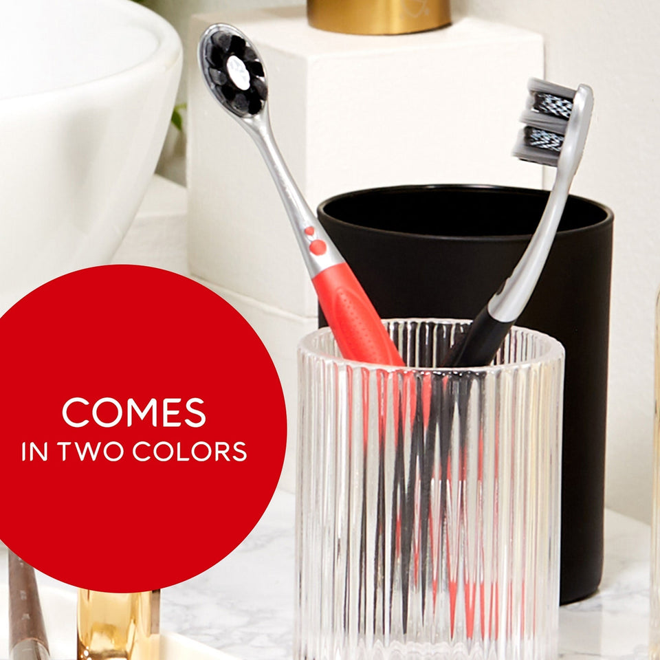 Two Optic White Pro Series Charcoal Manual Toothbrushes in a cup. In text: Comes in two colors.