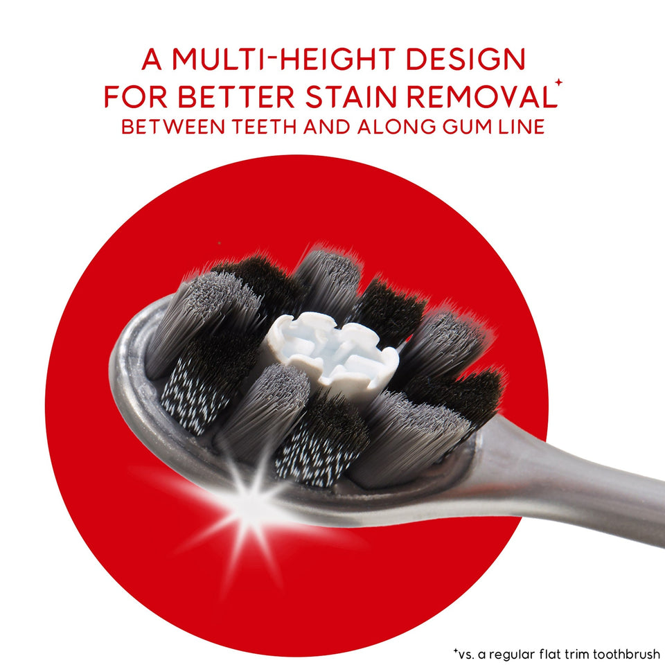 Optic White Pro Series Charcoal Manual Toothbrush for Adults. In text: A multi-height design for better stain removal* between teeth and along gum line. *Vs. a regular flat trim toothbrush.