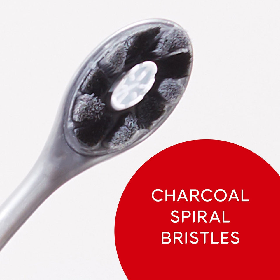 Optic White Pro Series Charcoal Manual Toothbrush for Adults. In text: Charcoal spiral bristles.