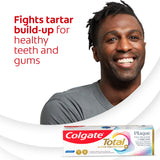 A man smiling, with a box of Colgate Total Plaque Pro Release Whitening Toothpaste. In text: Fights tartar build-up for healthy teeth and gums.
