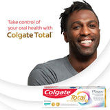 A man smiling, with a box of Colgate Total Plaque Pro Release Whitening Toothpaste. In text: Take control of your oral health with Colgate Total®.