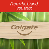 A close-up of the Colgate logo on the Colgate Bamboo toothbrush. In text: From the brand you trust.