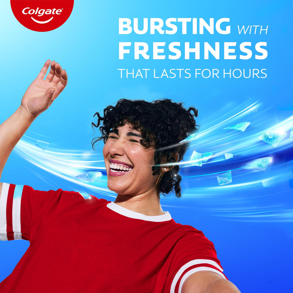 A woman with white teeth laughing. In text: Bursting with freshness that lasts for hours.